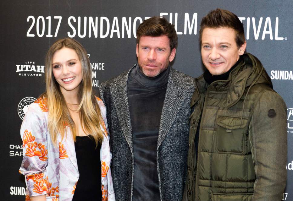 Rick Egan  |  The Salt Lake Tribune

Elizabeth Olsen, Taylor Sheridan and Jeremy Renner at the Eccles Theatre for the world premiere of "Wind River" at the 2017 Sundance Film Festival in Park City, Saturday, January 21, 2017.