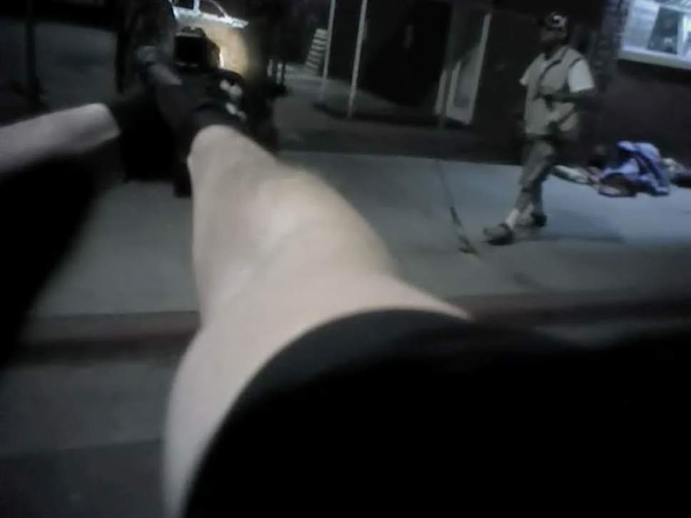 In this screen grab from the body cam Salt Lake City police officer Jordan Winegard can be seen firing his first shot at Abdullahi "Abdi" Mohamed as he was involved in an altercation with Kelly Mcrae, right, on Rio Grande Street in Feb. 2016.