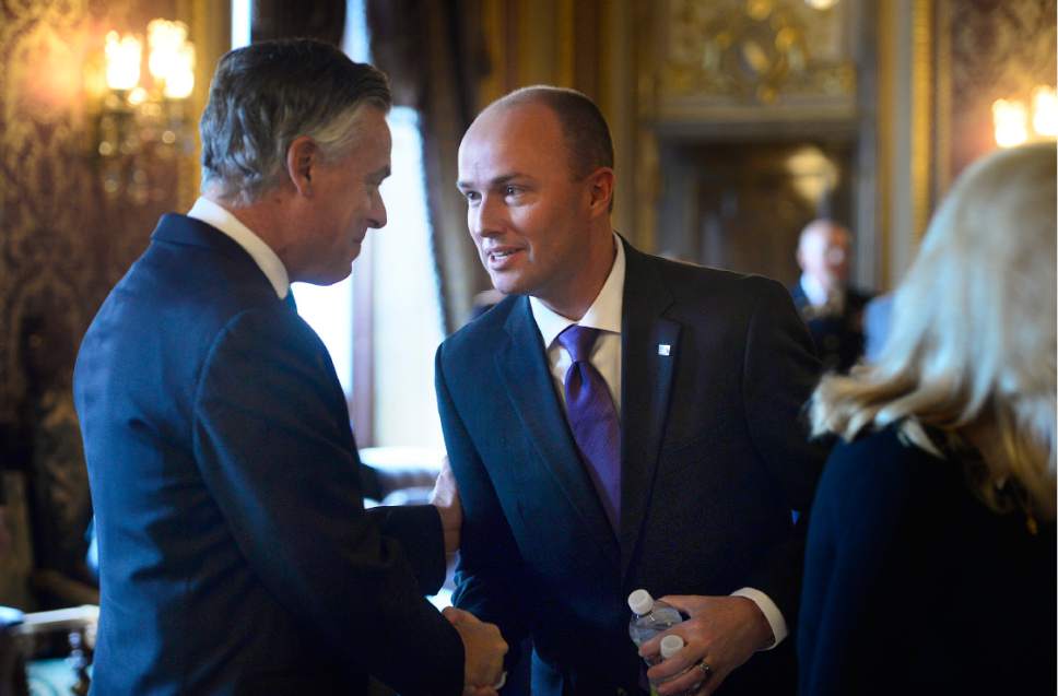 Scott Sommerdorf   |  The Salt Lake Tribune  
Utah Lieutenant Governor Spencer J. Cox, left, stops to greet former Utah Governor and United States Ambassador, Jon M. Hunstman Jr. prior to the State of Utah's Inaugural Ceremony in during a gathering in the Gold Room, Wednesday, January 4, 2017.