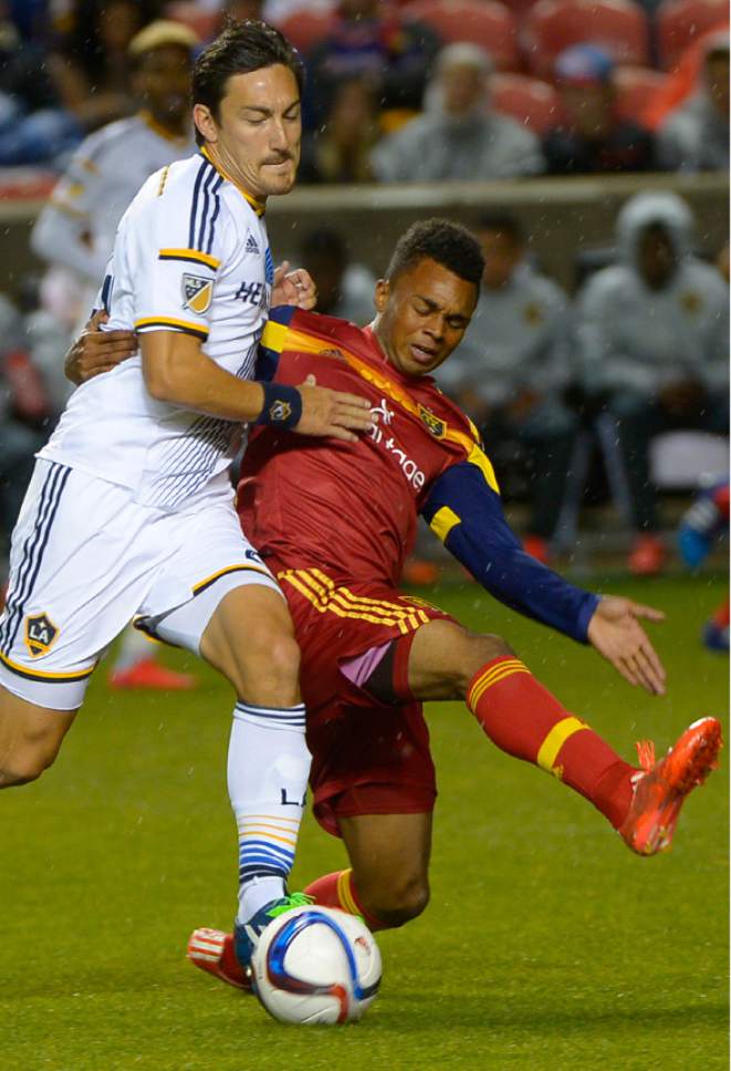 Leah Hogsten  |  The Salt Lake Tribune
Los Angeles Galaxy midfielder Stefan Ishizaki (24) battles Real Salt Lake defender/midfielder Jordan Allen (7). Real Salt Lake and LA Galaxy are 0-0 during the first half of their game at Rio Tinto Stadium, May 6, 2015.
