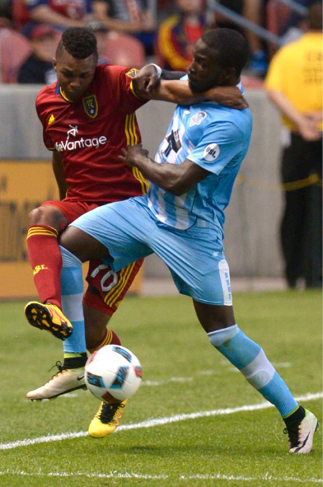 Leah Hogsten  |  The Salt Lake Tribune
Real Salt Lake midfielder Jordan Allen (70) and Wilmington's Peabo Dove take their battle out of bounds. Real Salt Lake is a goal behind Wilmington Hammerheads FC 0-1 at the half during their fourth round 2016 U.S. Open Cup match at Rio Tinto Stadium, Tuesday, June 14, 2016 in Sandy.