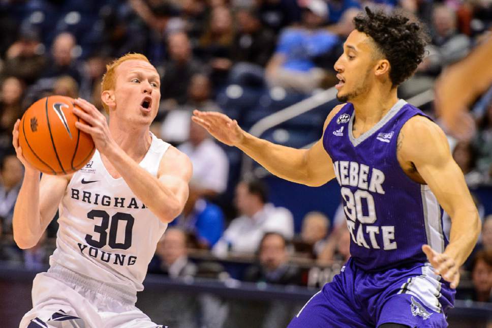 Trent Nelson  |  The Salt Lake Tribune
Brigham Young Cougars guard TJ Haws (30) is defended by Weber State Wildcats guard Jeremy Senglin (30) as BYU hosts Weber State, NCAA basketball at the Marriott Center in Provo, Wednesday December 7, 2016.