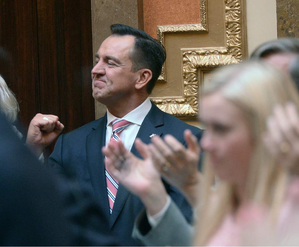Al Hartmann  |  The Salt Lake Tribune
Speaker of the House Greg Hughes pumps his fist as he is applauded by members of the House of Representatives before taking the oath of office Monday Jan. 23 during the first day of the 2107 Legislative session at the Utah State Capitol.