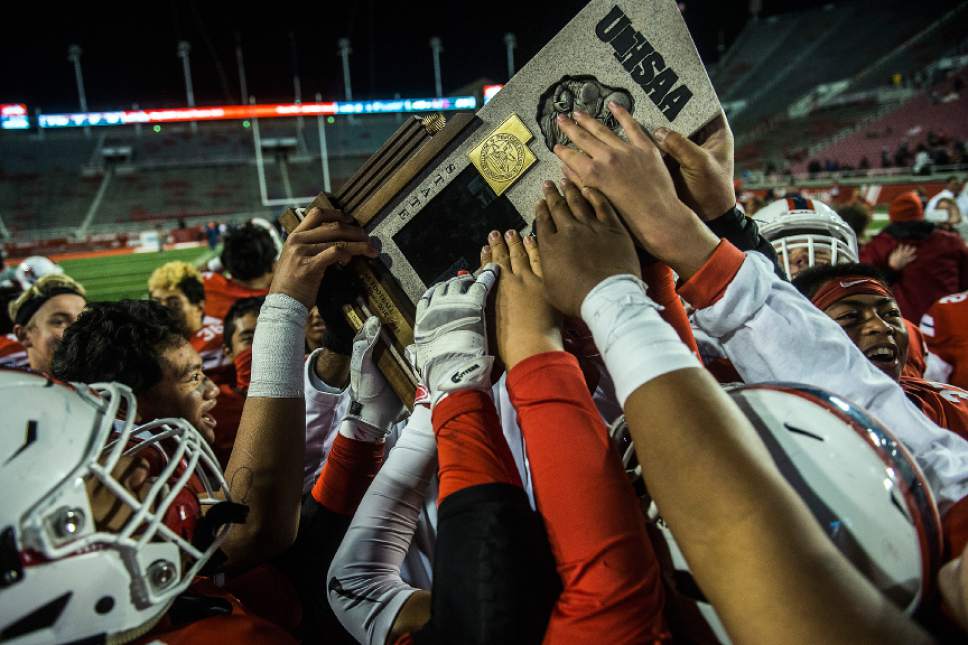 Chris Detrick  |  The Salt Lake Tribune
Members of the East football team celebrate after winning the 4A football championship at Rice-Eccles Stadium Friday November 18, 2016. East defeated Springville 48-20.