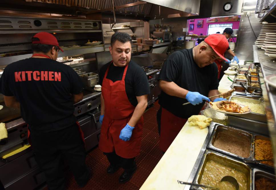 Francisco Kjolseth | The Salt Lake Tribune
Chefs Jose Pacheco, center, and Teo Bahena, right, are in constant motion as they stay on top of a recent lunch rush at Red Iguana 2. Unlike many restaurants where a single chef is calling all the shots, Red Iguana has a kitchen manager, Matthew Hewitt, and a team of 8 lead cooks that have mastered the sauces and other recipes.