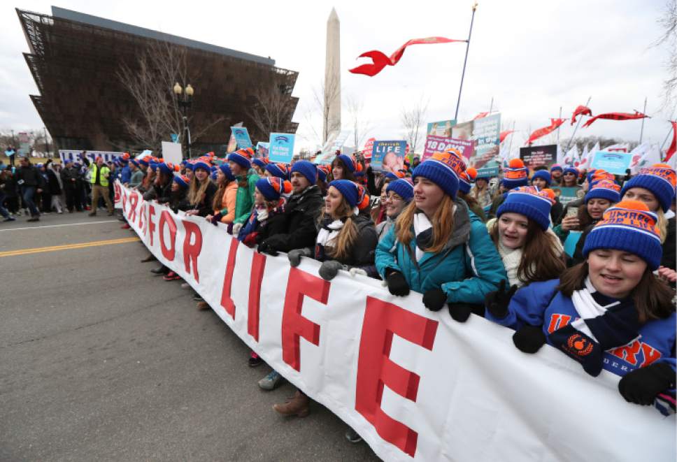 Natalie Brown from Brunswick, Maine, right, together with other participants in the March for Life march near the National Mall in Washington, Friday, Jan. 27, 2017. (AP Photo/Manuel Balce Ceneta)