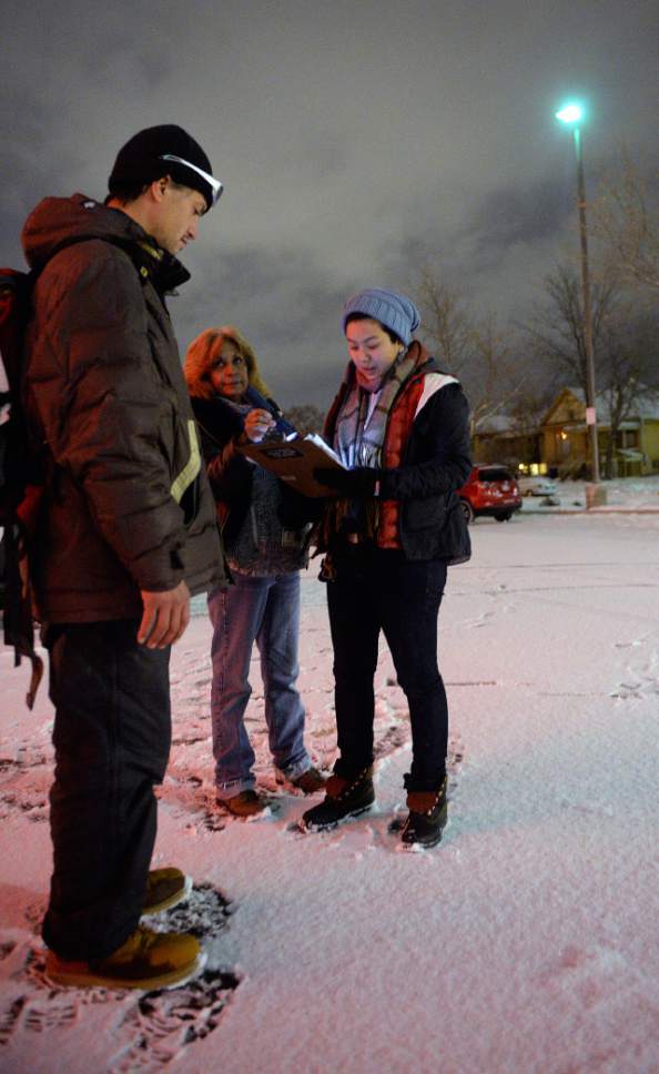 Al Hartmann  |  The Salt Lake Tribune
Volunteers set out at 4 a.m. Thursday Jan. 26 to search for homeless people on the streets for the Point-in-Time Homeless Count. Iosefa Johnson, left, who says that he's been homeless since twelve is interviewed by Carolyn Deherrera and volunteer Nikki Africano. 
Volunteers of America partners with Utah State Community Services Office and the Salt Lake County conducted the annual survey to count unsheltered individuals suffering from homelessness.