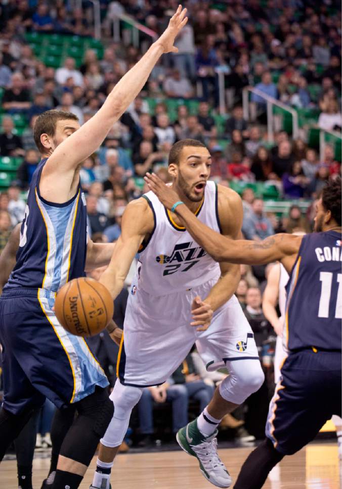 Lennie Mahler  |  The Salt Lake Tribune

Rudy Gobert passes the ball past Marc Gasol and Michael Conley in a game against the Memphis Grizzlies on Saturday, Jan. 28, 2017, at Vivint Smart Home Arena in Salt Lake City.