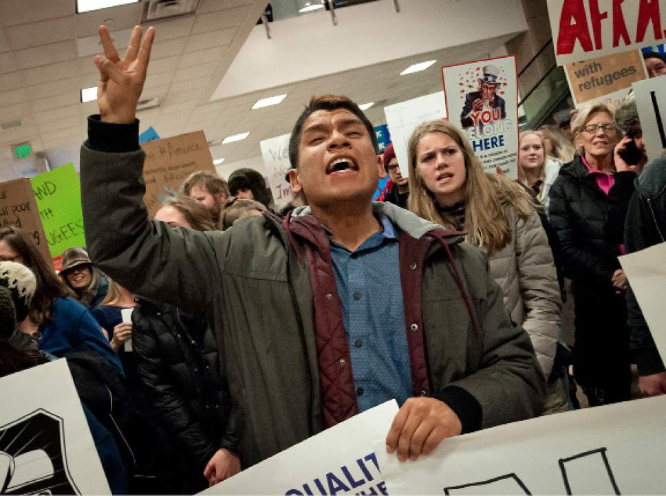 Michael Mangum  |  Special to the Tribune

Cristobal Villegas, of Mapleton, chants loudly with the crowd during a protest at the Salt Lake City International Airport on Saturday, January 28, 2017. Villegas said he came in support of those in the underrepresented communities such as immigrants and LGBT. Hundreds gathered to protest President Trump's executive order on immigration, among many other social topics.