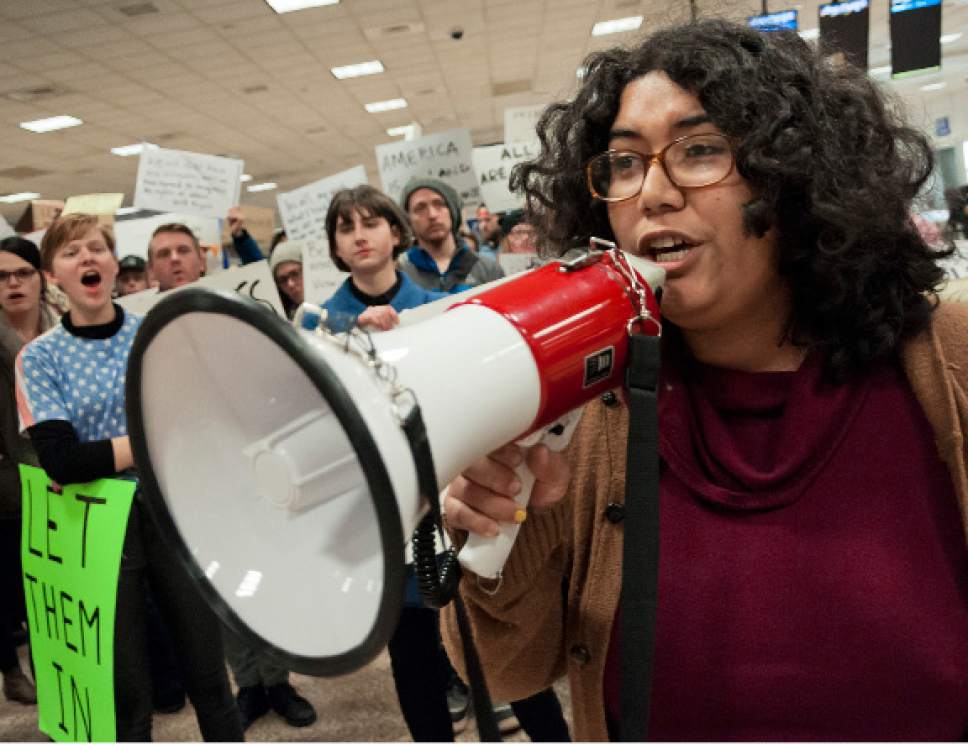 Michael Mangum  |  Special to the Tribune

Ella Mendoza, a woman who identified herself as an undocumented immigrant from Peru, speaks to the crowd during a protest at the Salt Lake City International Airport on Saturday, January 28, 2017. Hundreds gathered to protest President Trump's executive order on immigration, among many other social topics.