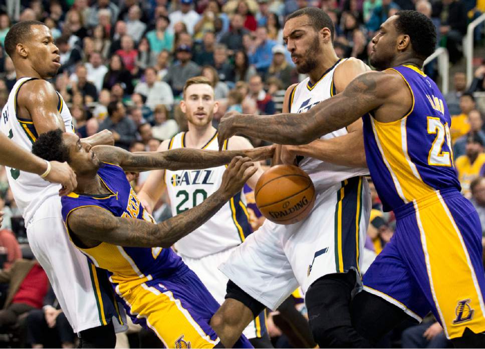 Lennie Mahler  |  The Salt Lake Tribune

From left, Rodney Hood, Lou Williams, Rudy Gobert, and Tarik Black struggle for a loose ball during a game between the Utah Jazz and the Los Angeles Lakers at Vivint Smart Home Arena in Salt Lake City, Saturday, Jan. 16, 2016.
