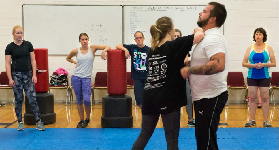 Leah Hogsten  |  The Salt Lake Tribune
Dixie State University instructor Sasha Trae demonstrates where to strike a man at vital points on his body if she is being attacked. Trae. teaches a 16-week course on abusive relationships and self-protection to create gender equality, respect and healthy boundaries.