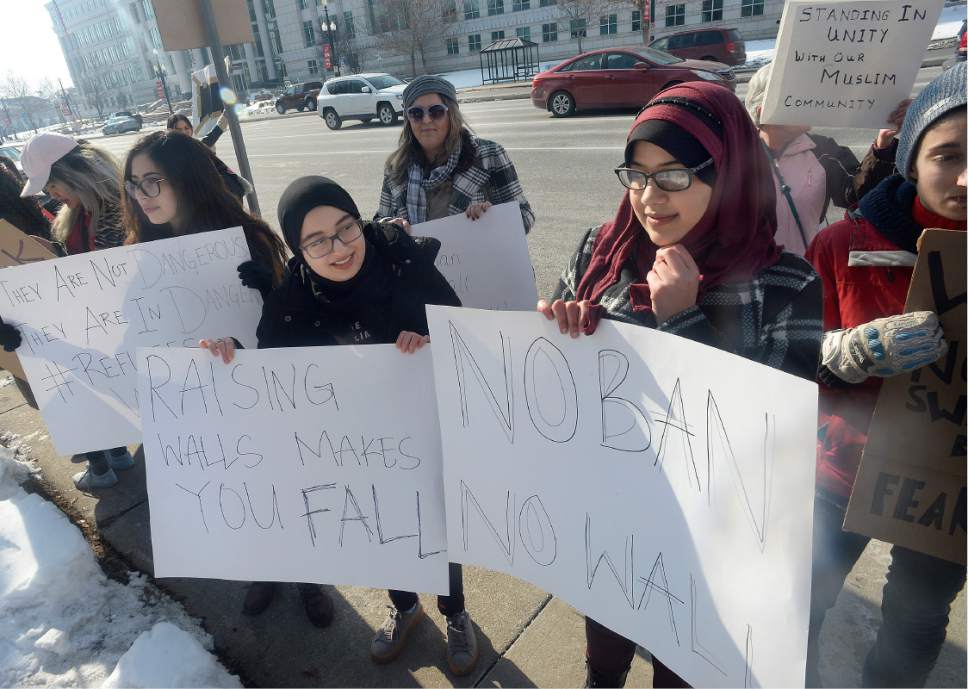 Scott Sommerdorf   |  The Salt Lake Tribune  
Protesters, including two Muslim women, Ban Naes, center/left, and Alaa Al Barkawi, center/right, marched around the City and County building to object to the recent ban on refugees entering the United States, Sunday, January 29, 2017.