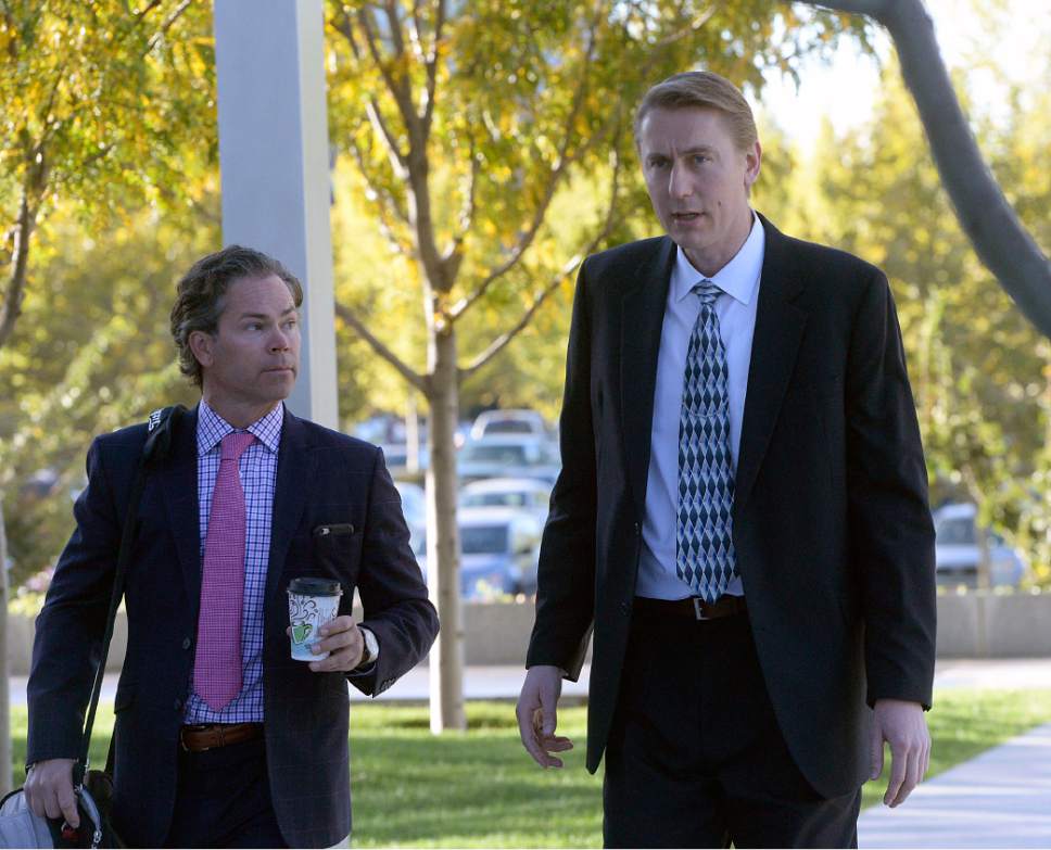 Al Hartmann  |  The Salt Lake Tribune
Nephi Allred, right, one of eleven members of the FLDS Church charged with foods stamp fraud and money laundering walks to Federal Court in Salt Lake City Tuesday Oct. 3 with his lawyer for a two-day hearing to hear testimony from FLDS members and government witnesses to determine whether defendants have a religious right to share their food stamp benefits.