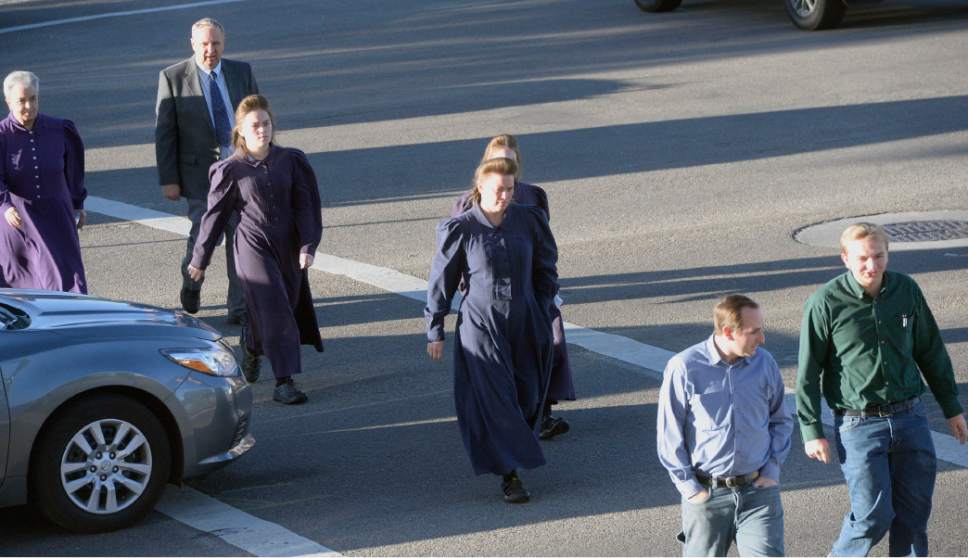 Al Hartmann  |  The Salt Lake Tribune
Members of the FLDS Church walk to Federal Court in Salt Lake City Tuesday Oct. 3 for a two-day hearing to hear testimony from FLDS members and government witnesses to determine whether defendants have a religious right to share their food stamp benefits.