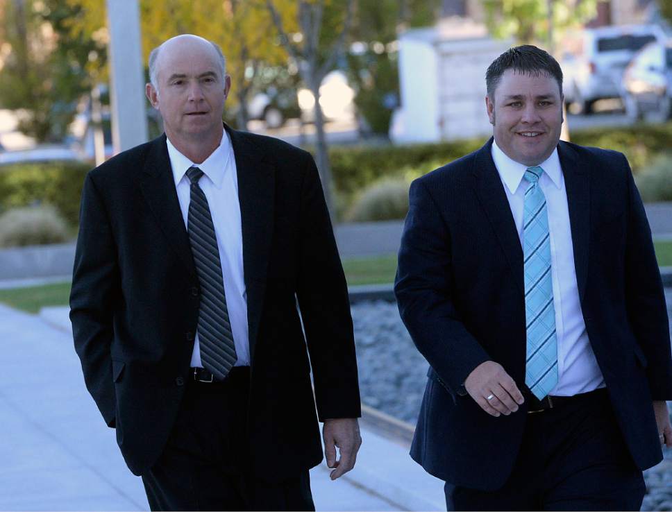 Al Hartmann  |  The Salt Lake Tribune
Winford Barlow, left, walks one of eleven members of the FLDS Church charged with foods stamp fraud and money laundering walks to Federal Court in Salt Lake City Tuesday Oct. 3 with his lawyer, Blake Hamilton, for a two-day hearing to hear testimony from FLDS members and government witnesses to determine whether defendants have a religious right to share their food stamp benefits.