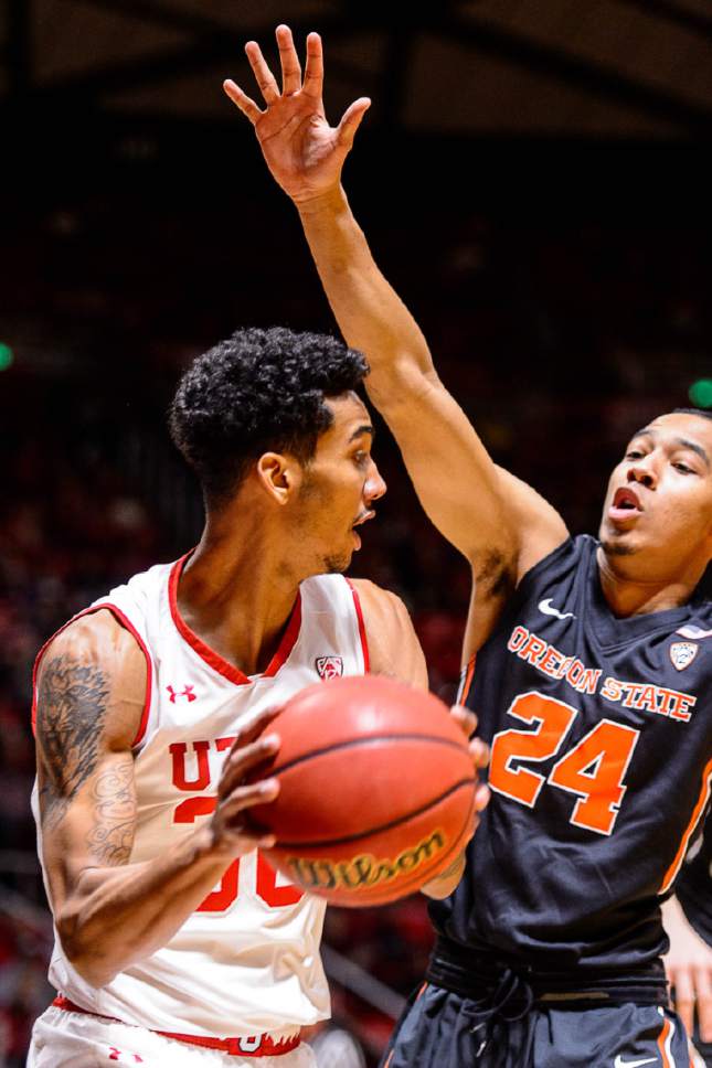 Trent Nelson  |  The Salt Lake Tribune
Utah Utes guard Gabe Bealer (30) defended by Oregon State Beavers guard Kendal Manuel (24) as the University of Utah hosts Oregon State, NCAA basketball at the Huntsman Center in Salt Lake City, Saturday January 28, 2017.
