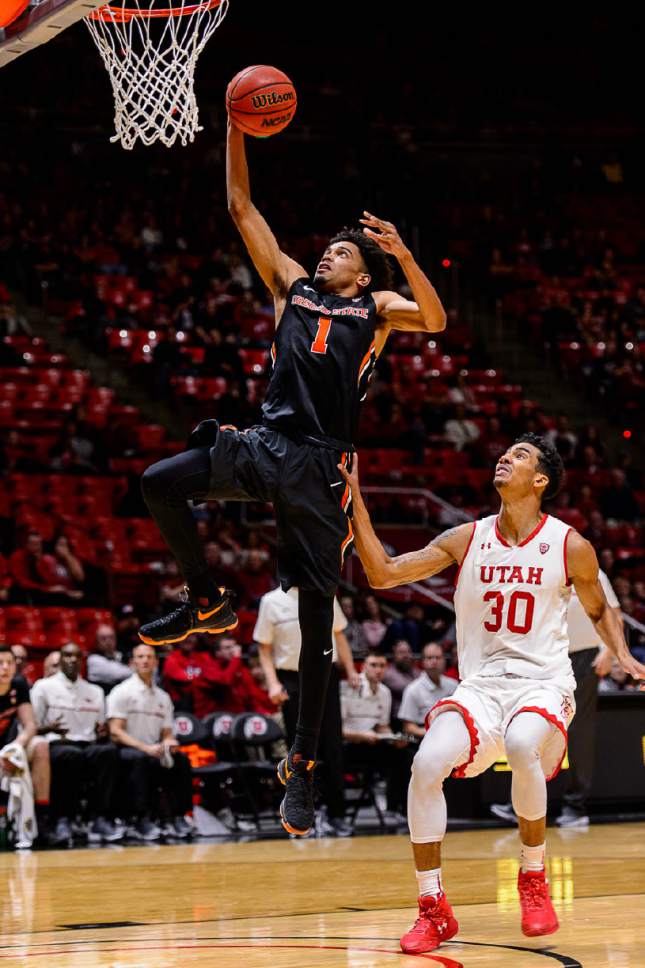 Trent Nelson  |  The Salt Lake Tribune
Oregon State Beavers guard Stephen Thompson Jr. (1) puts up a shot ahead of Utah Utes guard Gabe Bealer (30) as the University of Utah hosts Oregon State, NCAA basketball at the Huntsman Center in Salt Lake City, Saturday January 28, 2017.