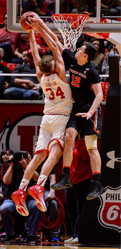 Trent Nelson  |  The Salt Lake Tribune
Utah Utes forward Jayce Johnson (34) is fouled by Oregon State Beavers forward Drew Eubanks (12) as the University of Utah hosts Oregon State, NCAA basketball at the Huntsman Center in Salt Lake City, Saturday January 28, 2017.