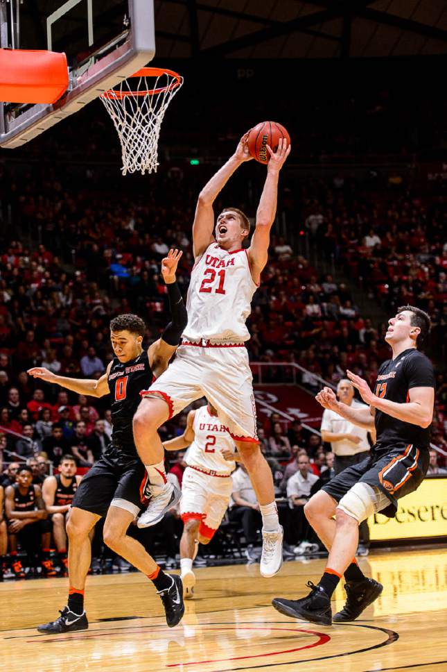 Trent Nelson  |  The Salt Lake Tribune
Utah Utes forward Tyler Rawson (21) is fouled by Oregon State Beavers guard Jaquori McLaughlin (0) as the University of Utah hosts Oregon State, NCAA basketball at the Huntsman Center in Salt Lake City, Saturday January 28, 2017.
