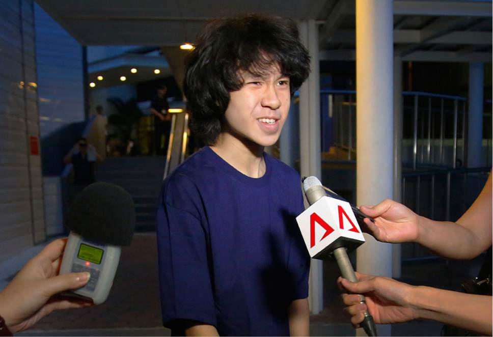 FILE - In this May, 12, 2015, file photo, Singapore teen blogger Amos Yee speaks to reporters while leaving the Subordinate Courts after being released on bail in Singapore. Yee, who is seeking seeking asylum after online posts mocking his government landed him jail, appeared in a Chicago immigration court Monday, Jan. 30, 2017, via video from an Illinois jail where he's been held since immigration authorities took him into custody at O'Hare International Airport in December 2016. Yee's attorneys submitted his asylum application Monday. (AP Photo/Wong Maye-E, File)