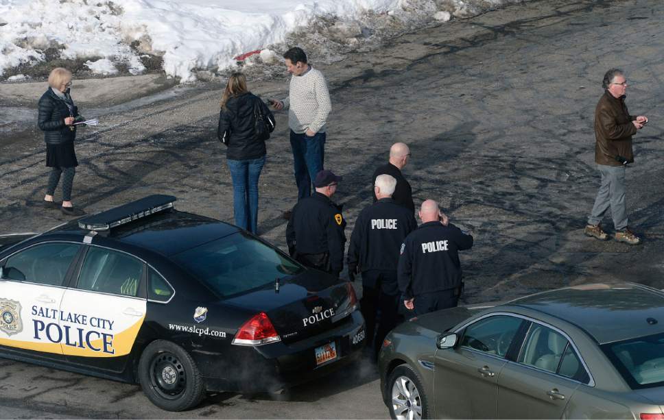 Al Hartmann  |  The Salt Lake Tribune
Salt Lake City Police wait with staff members outside the Jewish Community Center Tuesday Jan 31 as a bomb threat is being investigated.   Pre-school and kindergarten students were evacuated to the University of Utah Hospital nearby.