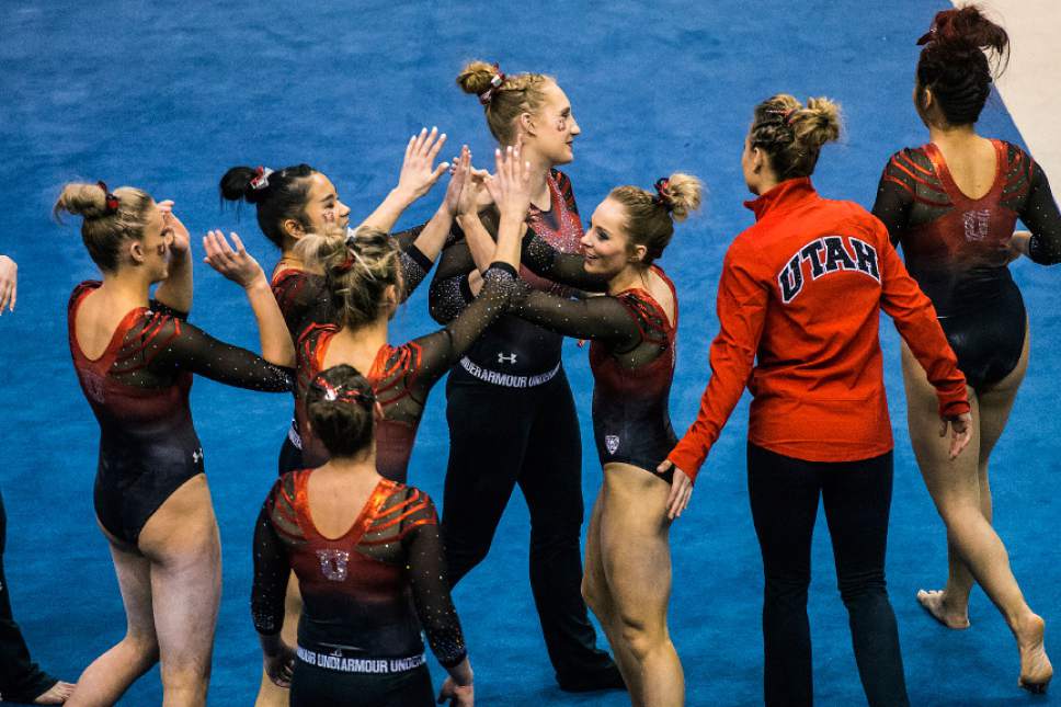 Chris Detrick  |  The Salt Lake Tribune
Utah's Mykayla Skinner celebrates with her teammates after competing on the floor during the gymnastics meet against Brigham Young University at the Marriott Center Friday January 13, 2017.