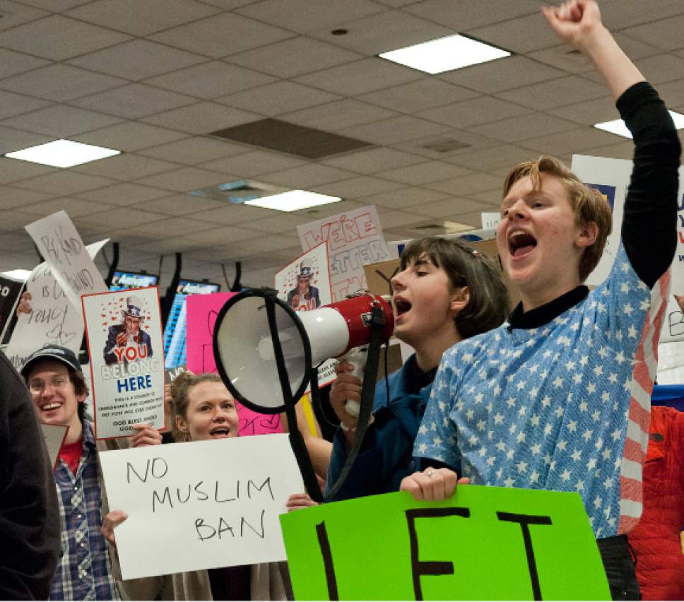 Michael Mangum  |  Special to the Tribune

Kim Gabbitas, right, and Hannah Morra, chant with the crowd during a protest at the Salt Lake City International Airport on Saturday, January 28, 2017. Hundreds gathered to protest President Trump's executive order on immigration, among many other social topics.