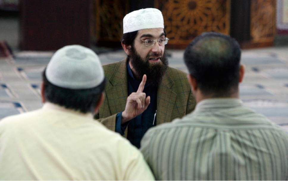 Francisco Kjolseth  |  The Salt Lake Tribune
Imam Muhammed S. Mehtar of the Islamic Society of Great Salt Lake in West Valley City leads a discussion following prayers on Monday, May 2, 2011, following the announcement of Osama bin Laden's death. Imam Mehtar emphasized "Be honest in everything you do," during the discussion with the small group gathered for prayers.