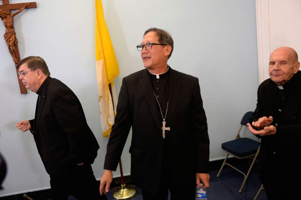Al Hartmann  |  The Salt Lake Tribune 
Bishop elect Oscar Azarcon Solis, center, is introduced as the 10th Bishop of the Catholic Diocese of Salt Lake City Tuesday Jan. 10.  Msgr. Colin Bircumshaw left, and Msgr. Terrence Fitzgerald, right.