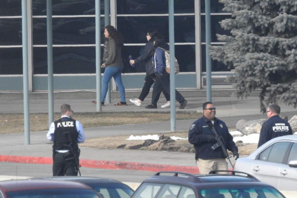 Chris Detrick  |  The Salt Lake Tribune
Unified Police Officers and students walk around the parking lot after a lockdown was lifted at Hillcrest High School in Midvale Wednesday February 1, 2017. UPD Detective Ken Hansen said that the school was put on lockdown about 10:10 a.m., as officers cordoned off the campus at 7350 S. 900 East. A subsequent sweep of the high school and its classrooms turned up no evidence that the report was legitimate.
