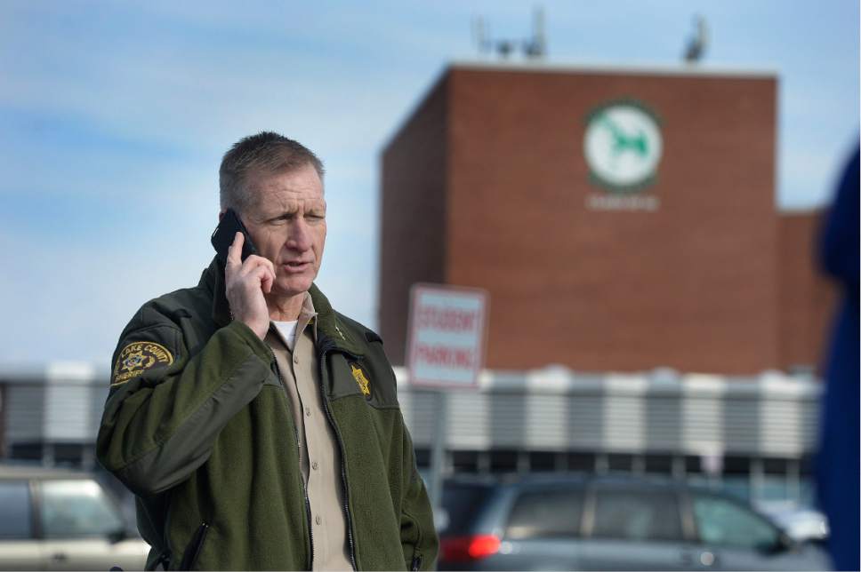 Scott Sommerdorf   |  The Salt Lake Tribune  
Sheriff Jim Winder takes a phone call in the parking lot at Hillcrest High School, Wednesday, February 1, 2017. There were early reports of an active shooter in the school, but it later became apparent the reports were a hoax.
