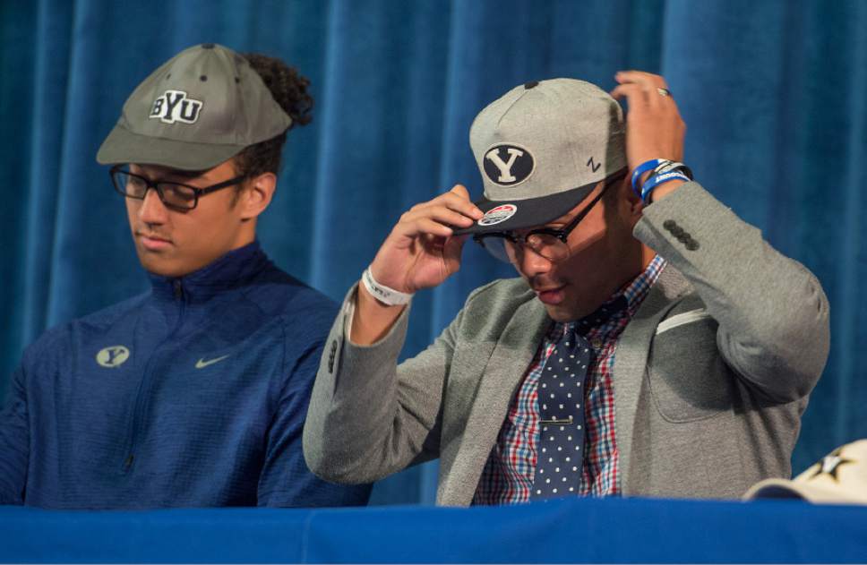 Leah Hogsten  |  The Salt Lake Tribune
l-r Bingham High School senior football team linebackers, Langi Tuifua and Brigham Tuatagaloa, announced their intentions to play for BYU in the fall. Over 12 Bingham High School students announced their choices Wednesday, February 1, 2017 during the school's college signing day ceremony.