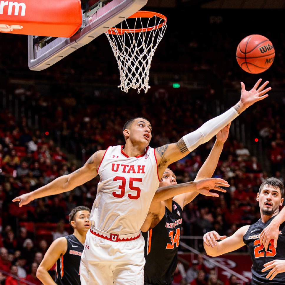 Utah forward Kyle Kuzma (35) reaches for the ball, with Oregon State forward Ben Kone (34) right behind, during an NCAA college basketball game Saturday, Jan. 28 2017, in Salt Lake City. (Trent Nelson/The Salt Lake Tribune via AP)/The Salt Lake Tribune via AP)