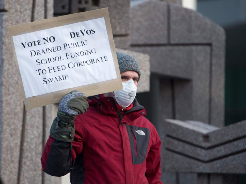 Rick Egan  |  The Salt Lake Tribune

BJ LeBaron and other demonstrators protest the nomination of Betsy DeVos as secretary of education at the Wallace F. Bennet Federal Building on Monday, Jan. 30, 2017.