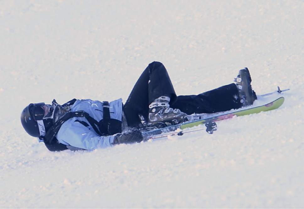 Rick Egan  |  The Salt Lake Tribune

Erin Alberty takes a fall on the Wildflower run at Snowbasin Resort, which was the women's downhill course in the 2002 Winter Olympics. Wednesday, January 18, 2017.