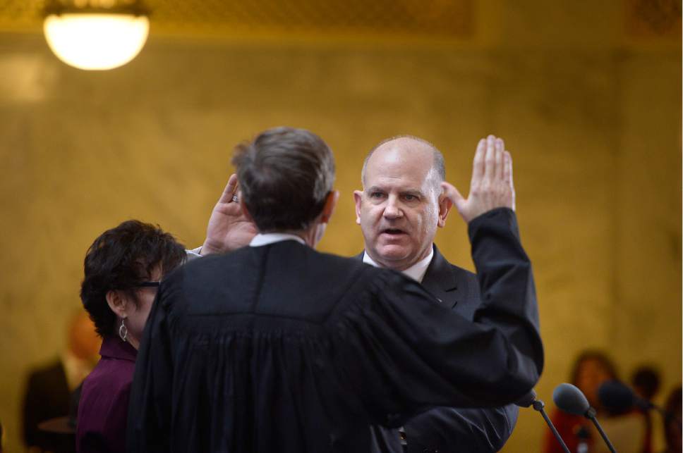 Scott Sommerdorf   |  The Salt Lake Tribune  
Utah Treasurer David C. Damschen takes his oath of office during the State of Utah's Inaugural Ceremony in the Capitol rotunda, Wednesday, January 4, 2017.