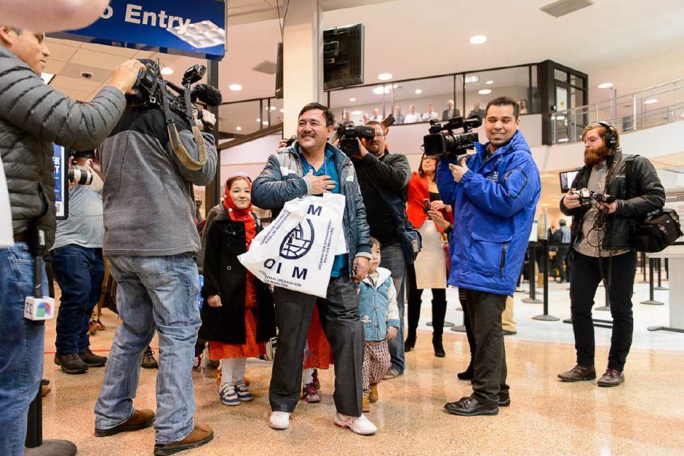 Trent Nelson  |  The Salt Lake Tribune
A large group welcomes a refugee family from Afghanistan (Hassan Ali, his wife Fozia, and their five children) to the Salt Lake City International Airport, Thursday February 2, 2017. The family members are likely the last refugees to arrive in Utah for the foreseeable future, as President Donald Trump's immigration ban takes effect.