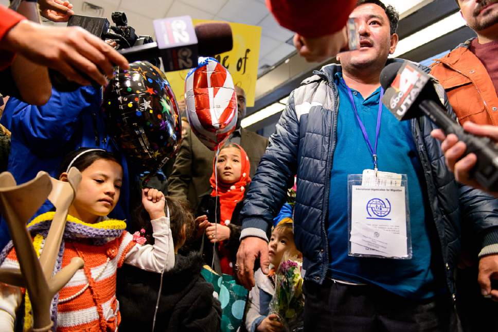 Trent Nelson  |  The Salt Lake Tribune
A large group welcomes a refugee family from Afghanistan (Hassan Ali, his wife Fozia, and their five children) to the Salt Lake City International Airport, Thursday February 2, 2017. The family members are likely the last refugees to arrive in Utah for the foreseeable future, as President Donald Trump's immigration ban takes effect.