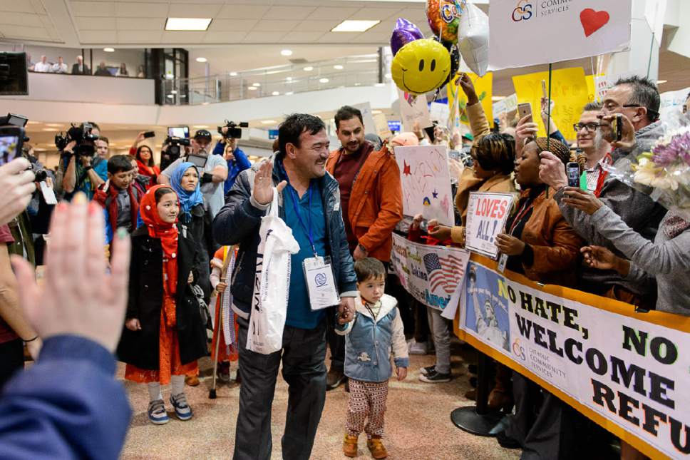 Trent Nelson  |  The Salt Lake Tribune
A large group welcomes a refugee family from Afghanistan (Hassan Ali, his wife Fozia, and their five children) to the Salt Lake City International Airport, Thursday February 2, 2017. The family members are likely the last refugees to arrive in Utah for the foreseeable future, as President Donald Trump's immigration ban takes effect.