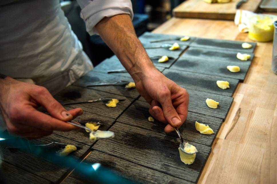 Chris Detrick  |  The Salt Lake Tribune
Chef and co-owner Nick Fahs, puts house-made butter on the bread plates at Table X in Millcreek.