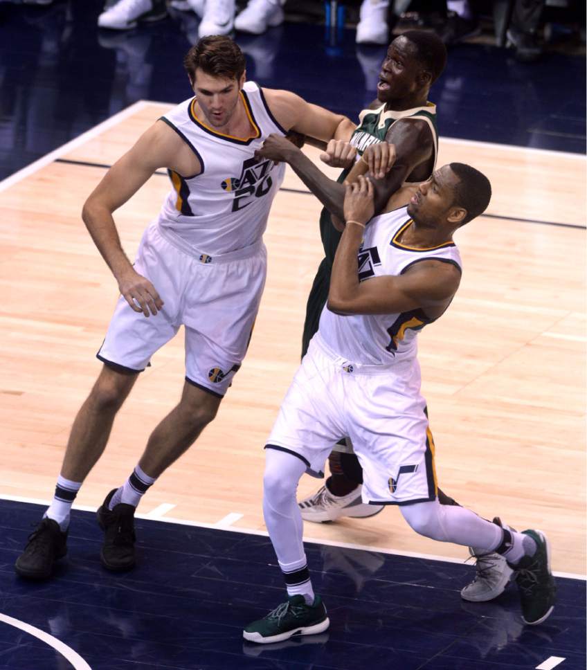 Steve Griffin / The Salt Lake Tribune

 Utah Jazz center Jeff Withey (24) and Utah Jazz guard Alec Burks (10) team up to keep Milwaukee Bucks forward Thon Maker (7) away from the basket during NBA game at Vivint Smart Home Arena in Salt Lake City Wednesday February 1, 2017.