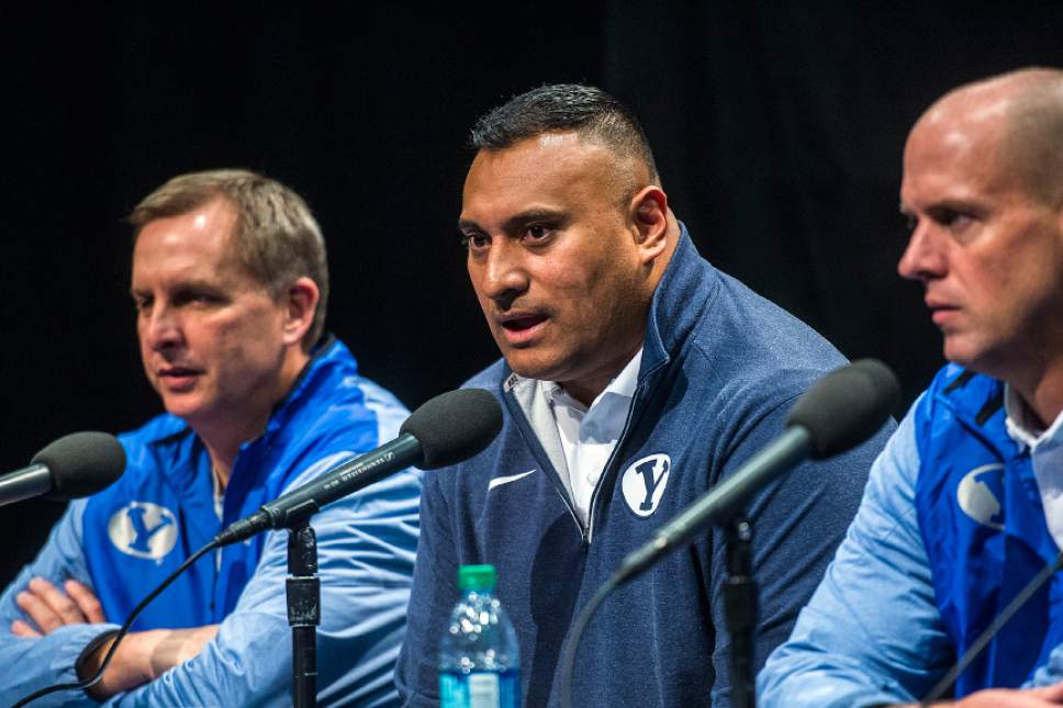 Chris Detrick  |  The Salt Lake Tribune
Head football coach Kalani Sitake speaks during a press conference at the BYU broadcasting building Wednesday February 1, 2017. At left is Offensive Coordinator Ty Detmer. At right is Assistant Head football coach Ed Lamb.