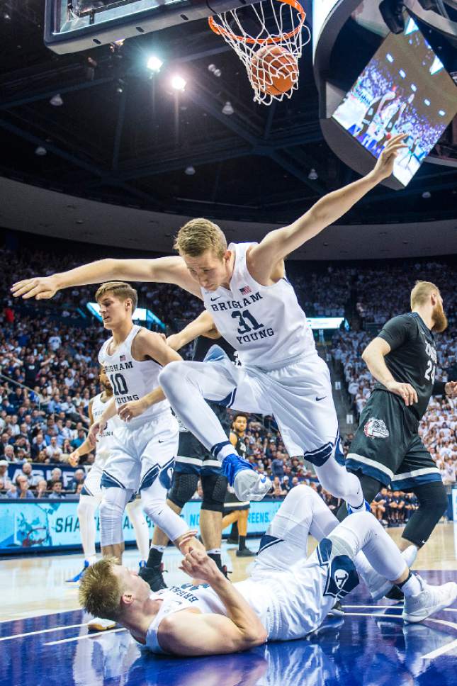 Chris Detrick  |  The Salt Lake Tribune
Brigham Young Cougars forward Braiden Shaw (31) jumps over Brigham Young Cougars forward Eric Mika (12) during the game at the Marriott Center Thursday February 2, 2017.
