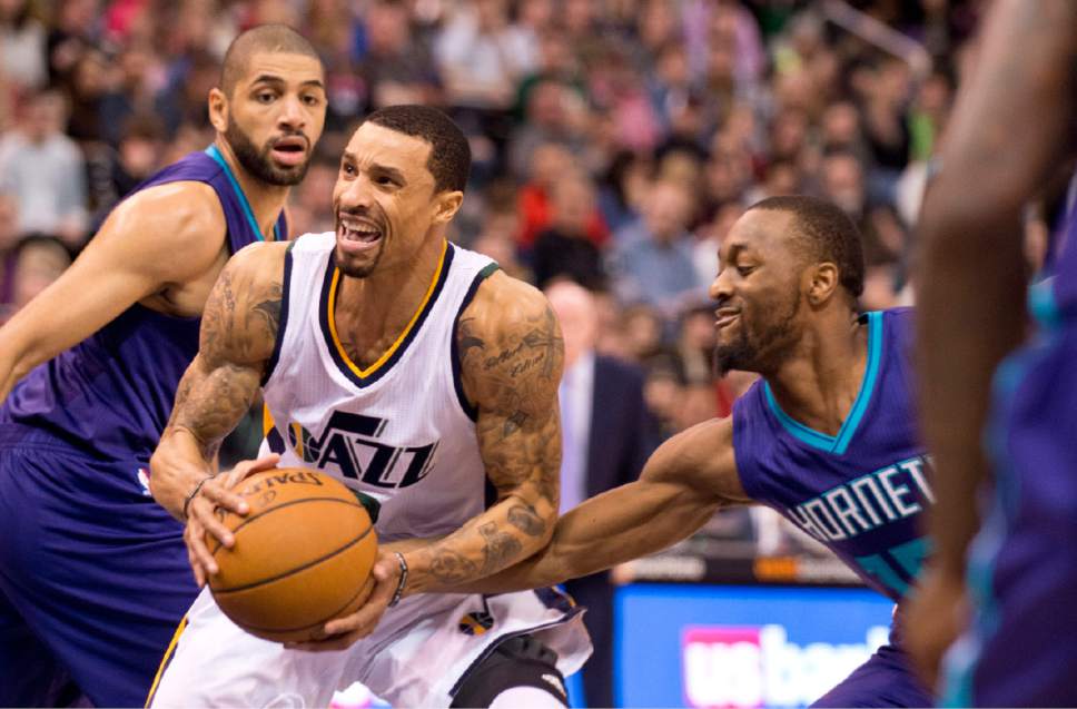 Lennie Mahler  |  The Salt Lake Tribune

George Hill drives past Charlotte's Nicolas Batum and Kemba Walker in a game at Vivint Smart Home Arena on Saturday, Feb. 4, 2017.
