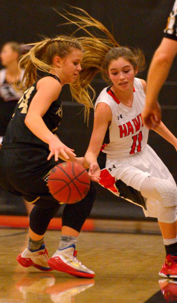 Leah Hogsten  |  The Salt Lake Tribune
Lone Peak's Brooke Peterson and Alta's Kemery Martin fight for a loose ball. Alta High School girls basketball defeated Lone Peak High School, 79-47 Tuesday, December 8, 2015.