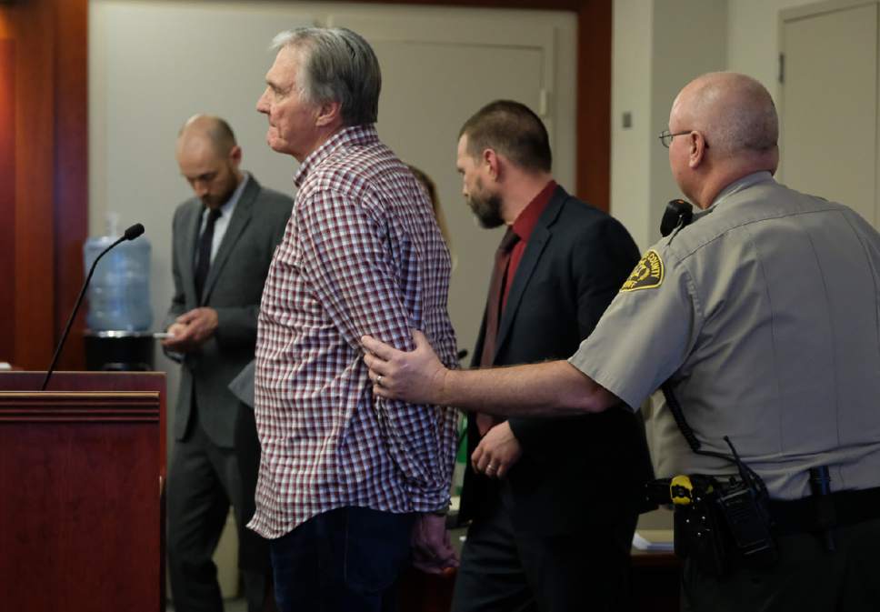 Francisco Kjolseth | The Salt Lake Tribune
Admitted fraudster Dee Randall, a Kaysville insurance agent, is handcuffed at the Matheson Courthouse, after being sentenced to jail by 3rd District Judge Mark Kouris on Monday, Feb. 6, 2017. Randall pleaded guilty in July of last year to five charges related to his operation of a Ponzi scheme that took in more than $72 million from about 700 people.