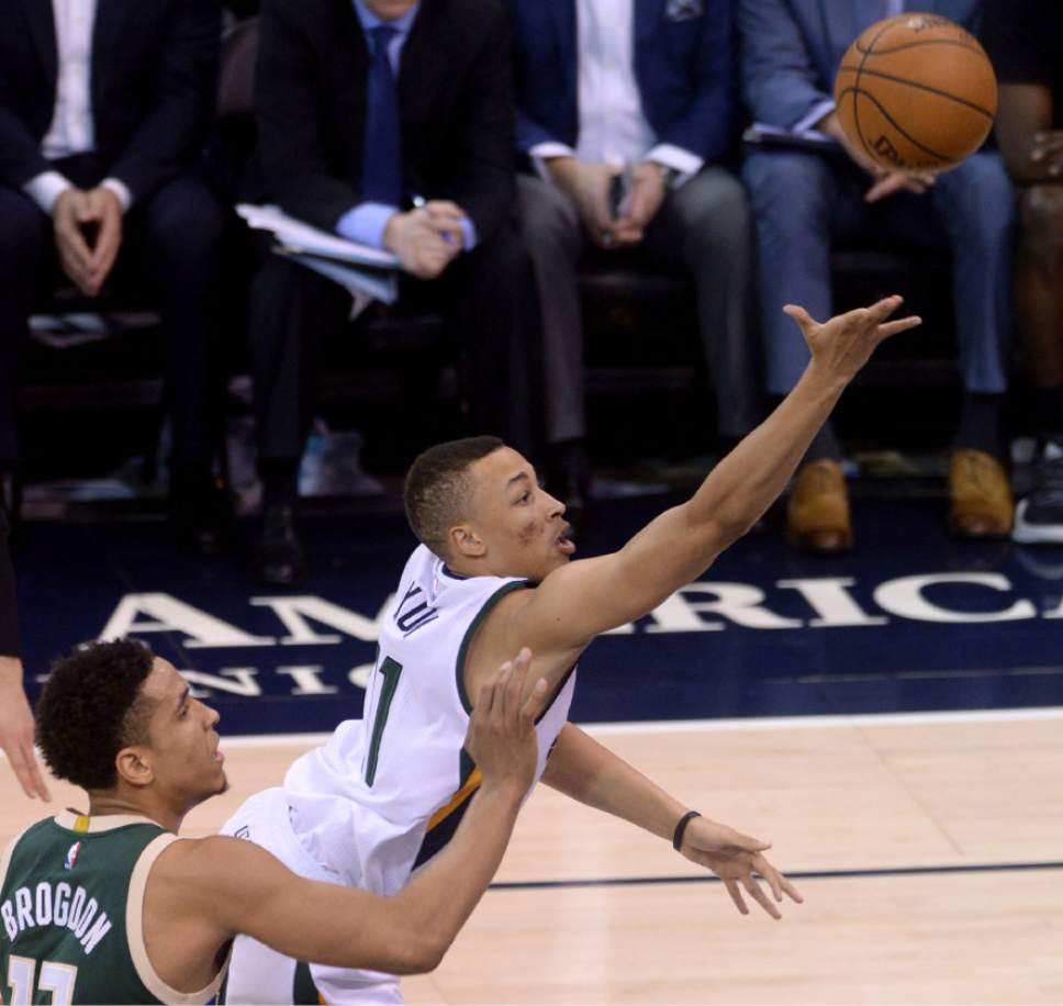 Steve Griffin / The Salt Lake Tribune

Utah Jazz guard Dante Exum (11) scoops up a shot as he gets by Milwaukee Bucks guard Malcolm Brogdon (13) during NBA game at Vivint Smart Home Arena in Salt Lake City Wednesday February 1, 2017.