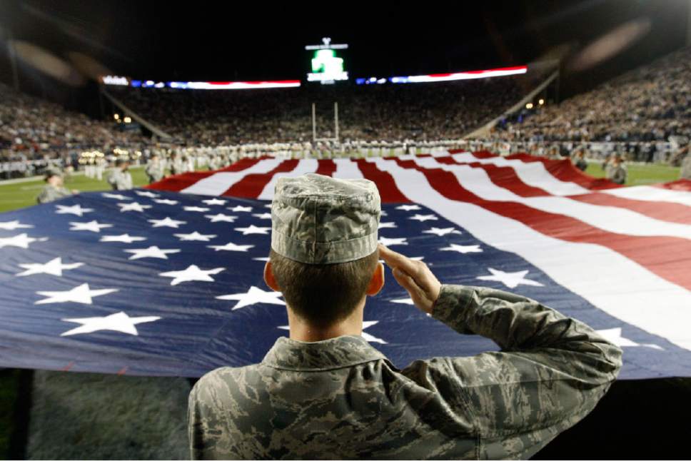Chris Detrick  |  The Salt Lake Tribune
Trevor Jax, and other members of the BYU Air Force ROTC, display an American flag before the game against USU at LaVell Edwards Stadium Friday October 5, 2012.