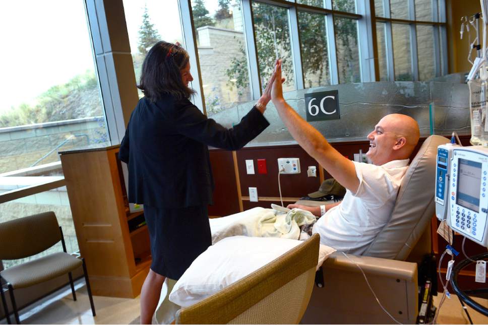 Scott Sommerdorf   |  The Salt Lake Tribune
Mary Beckerle, CEO, and director of the institute, gives patient Mike Houston a high five after he said he was just about at the end of his chemotherapy infusion program at the Huntsman Cancer Institute, Wednesday, August 26, 2015. 
------
The Huntsman Cancer Institute has been upgraded to the "comprehensive cancer institute" designation by the National Cancer Institutes, and now joins the ranks of the 45 top centers for research and patient care.